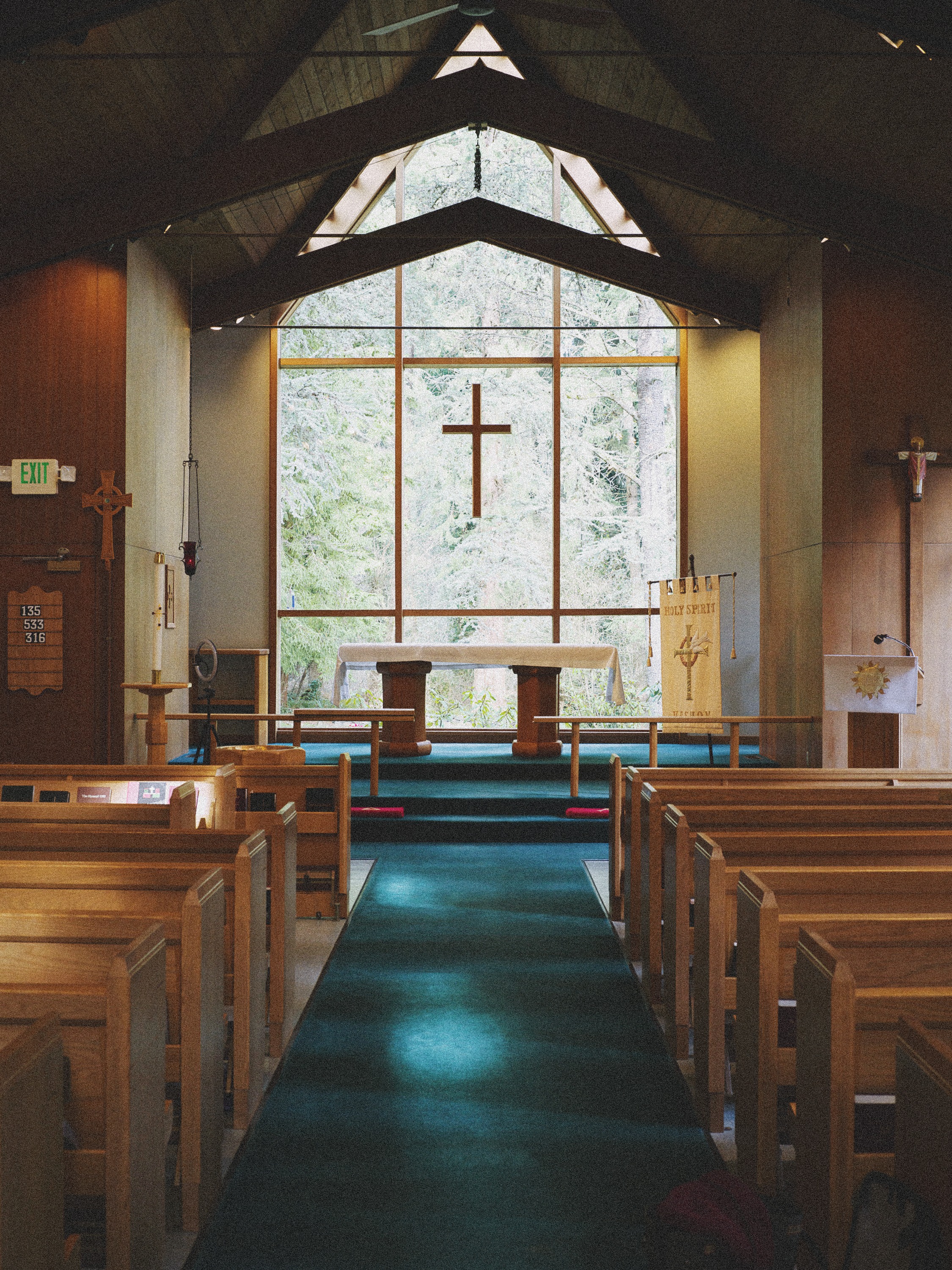View down the center aisle toward the altar and window