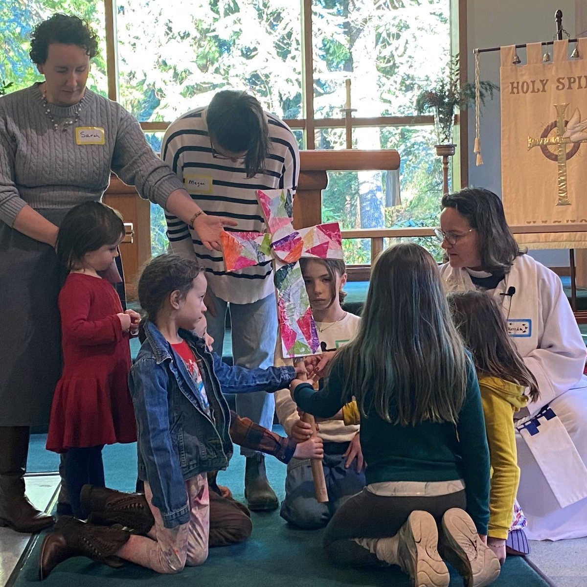 Meredith blessing the children’s cross